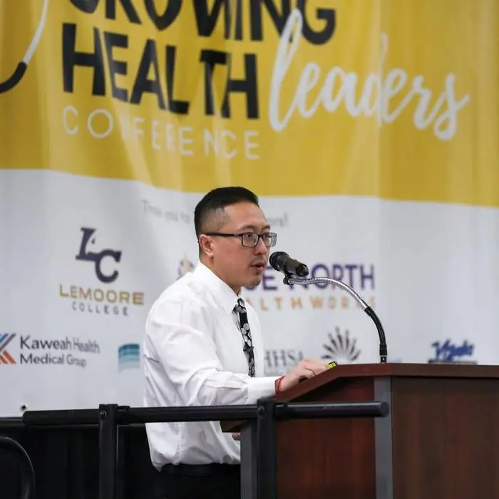 Sam Vang speaking at the Growing Health Leaders Conference
